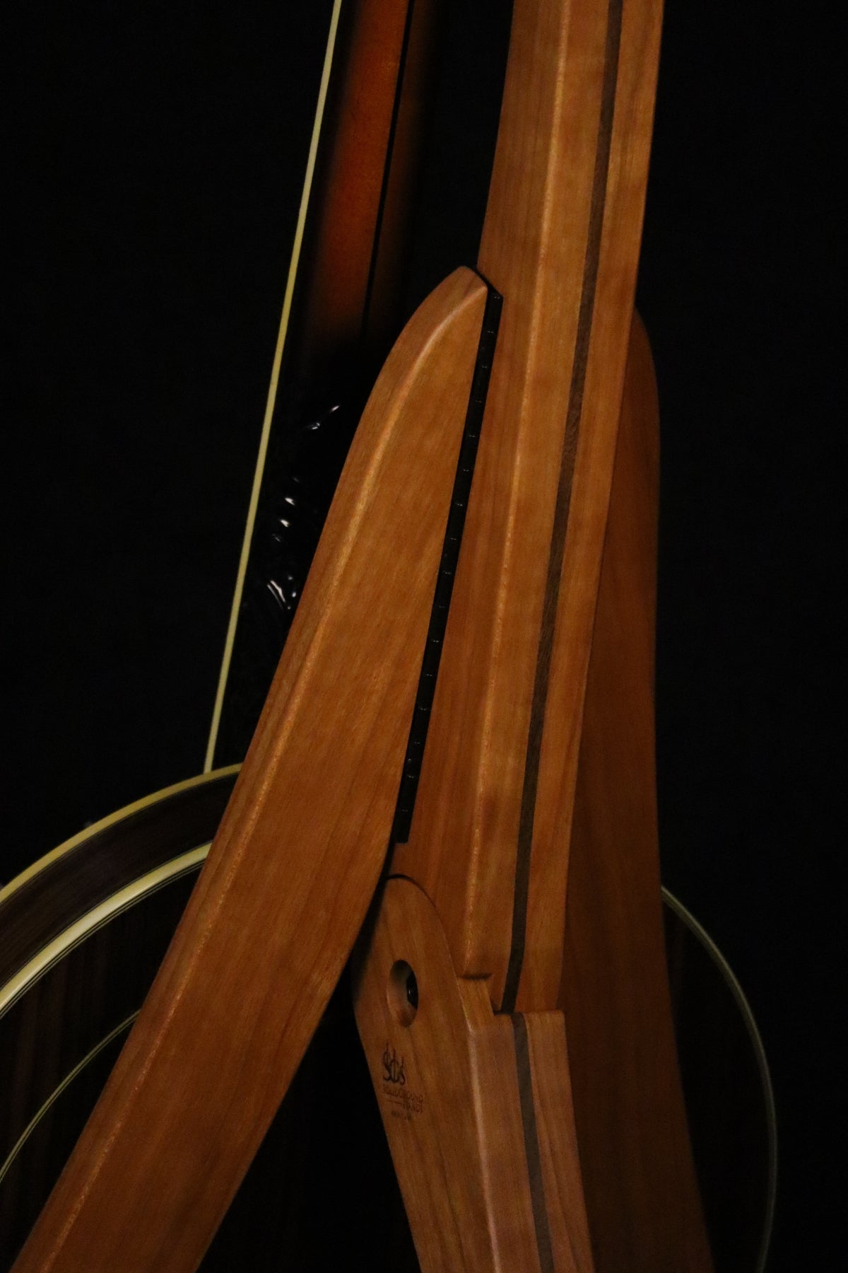Folding cherry and walnut wood banjo floor stand closeup rear image with Alvarez banjo