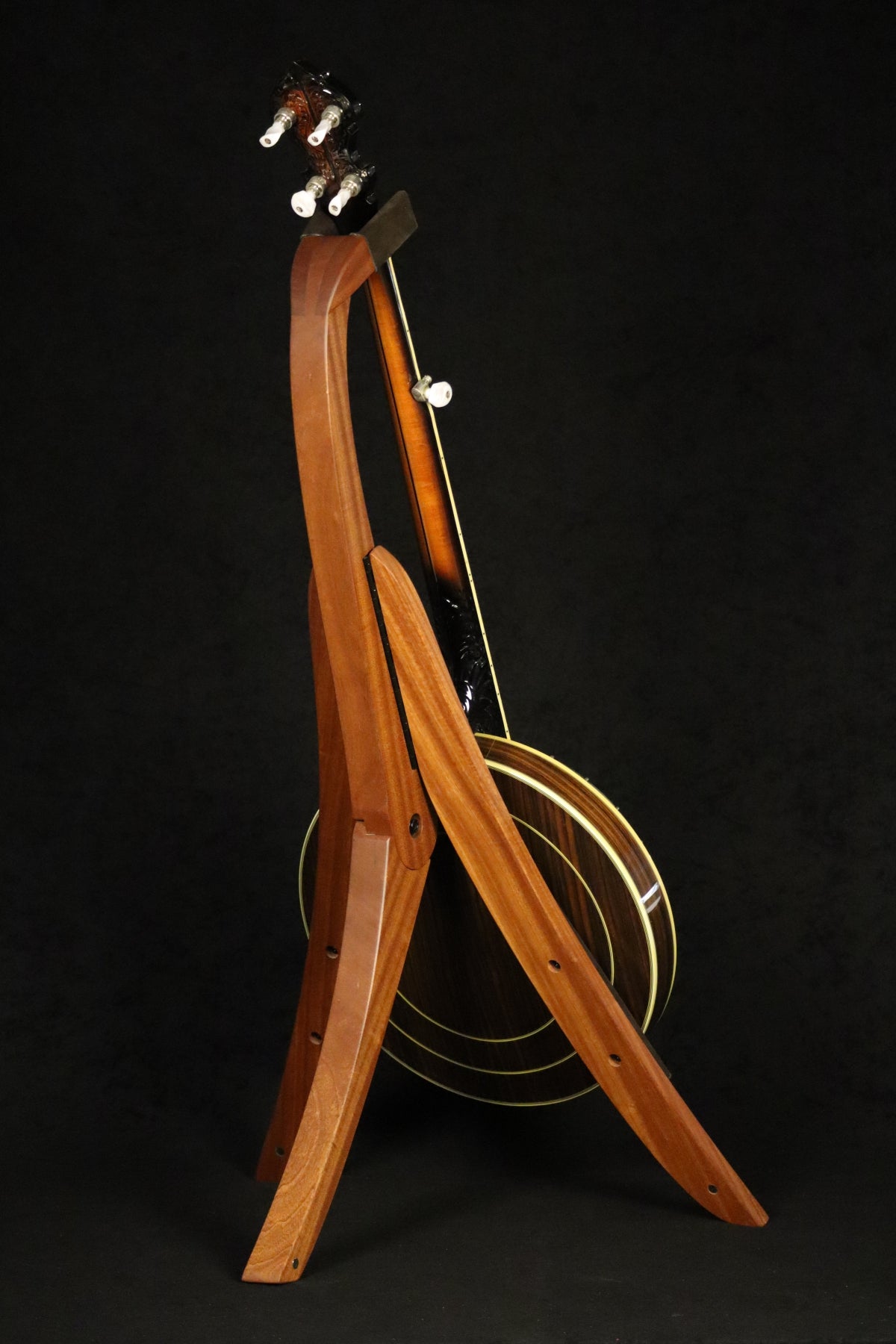 Folding sapele mahogany wood banjo floor stand full rear image with Alvarez banjo