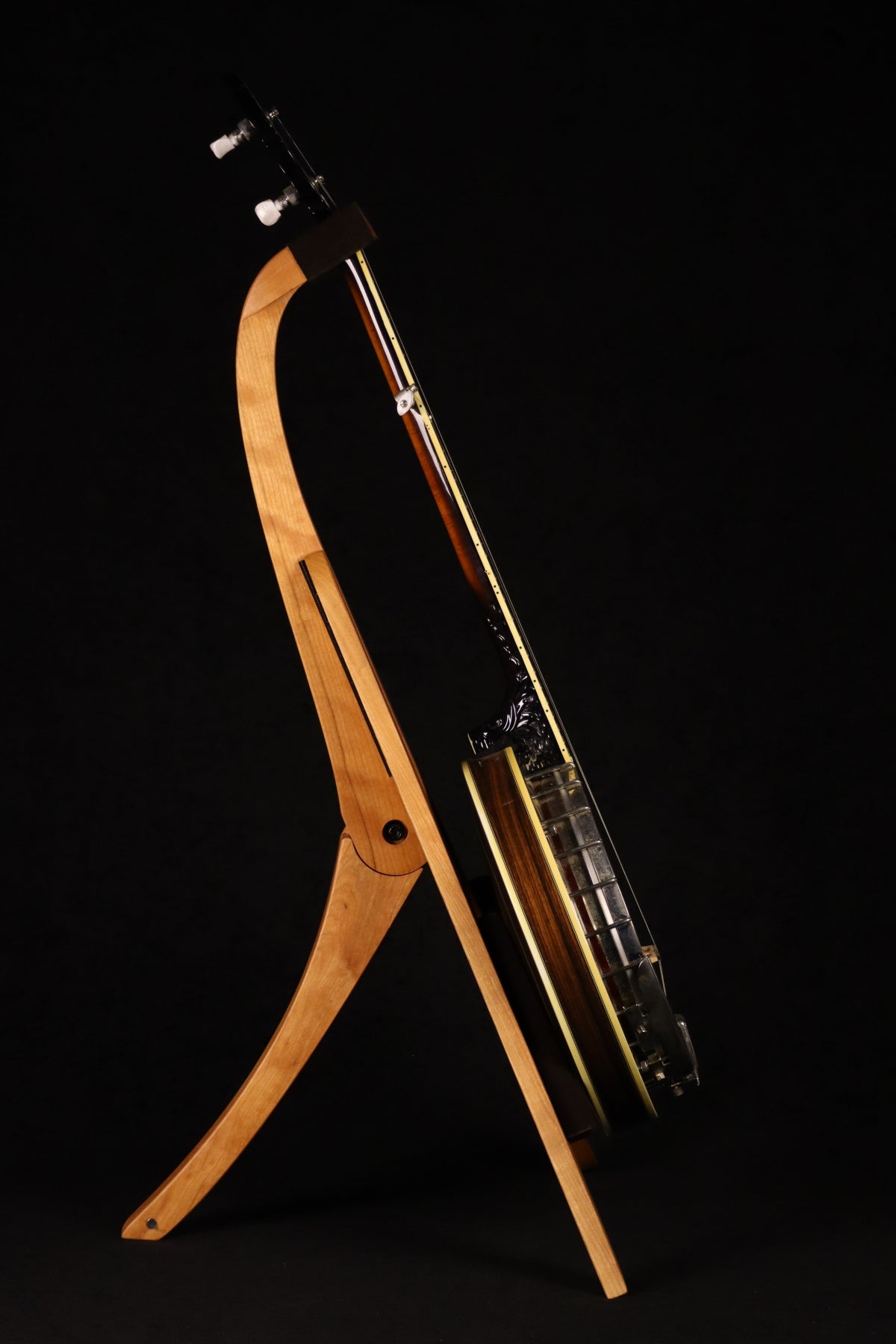 Folding cherry wood banjo floor stand full side image with Alvarez banjo