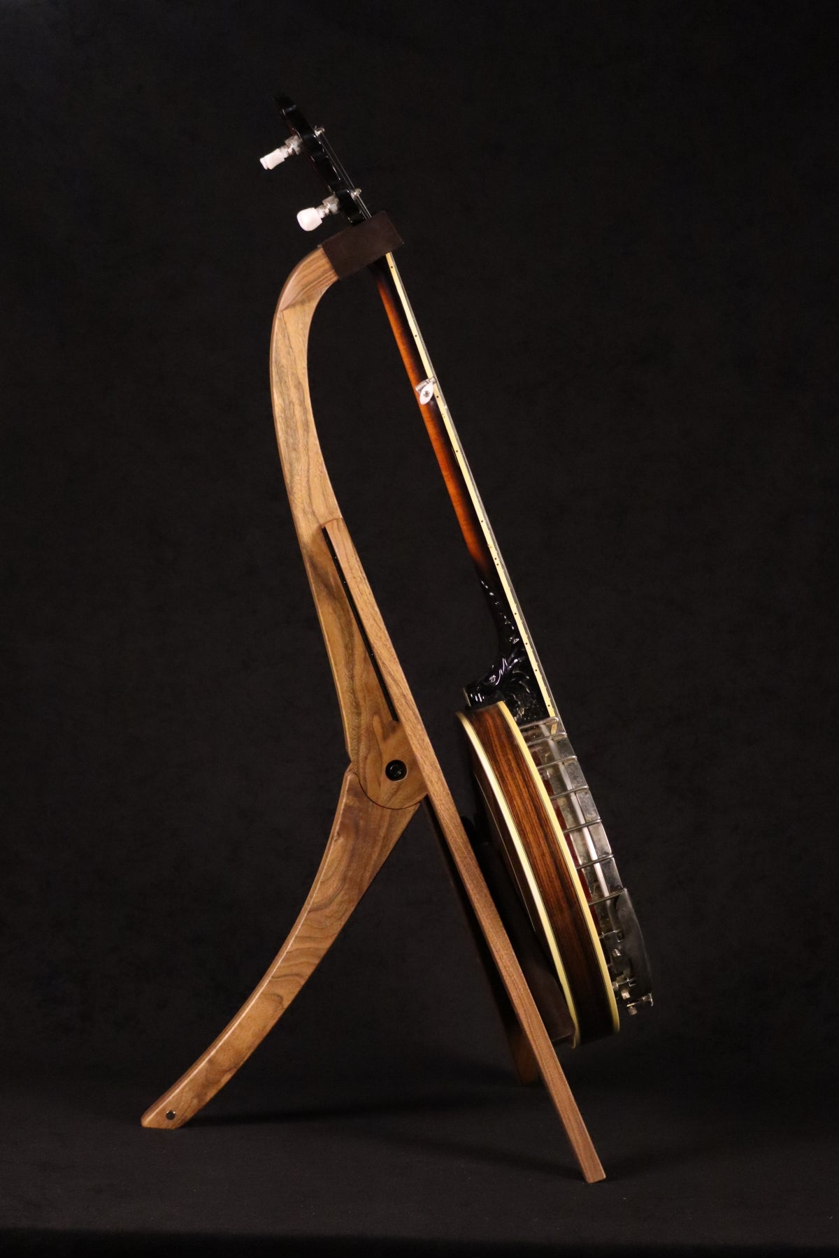 Folding walnut wood banjo floor stand full side image with Alvarez banjo