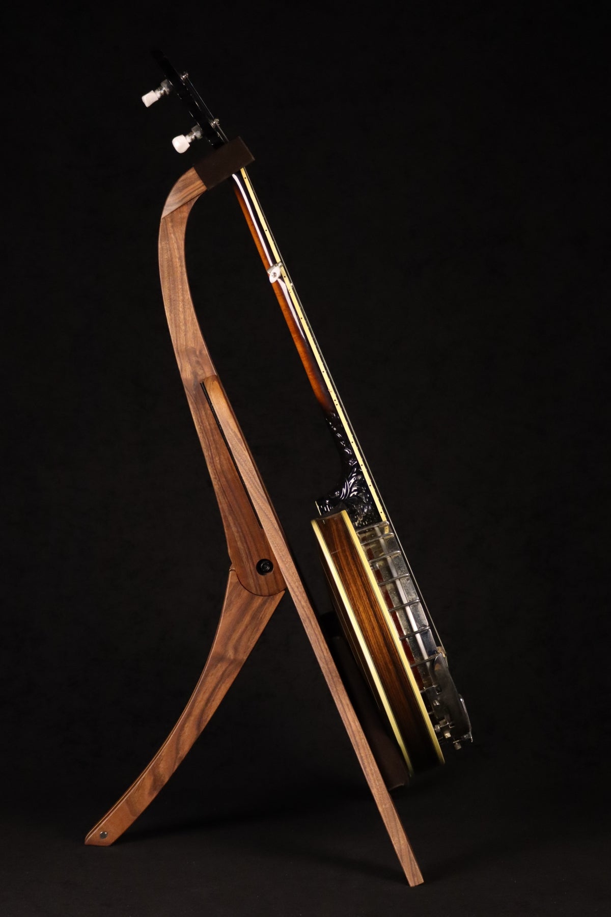 Folding walnut and curly maple wood banjo floor stand full side image with Alvarez banjo