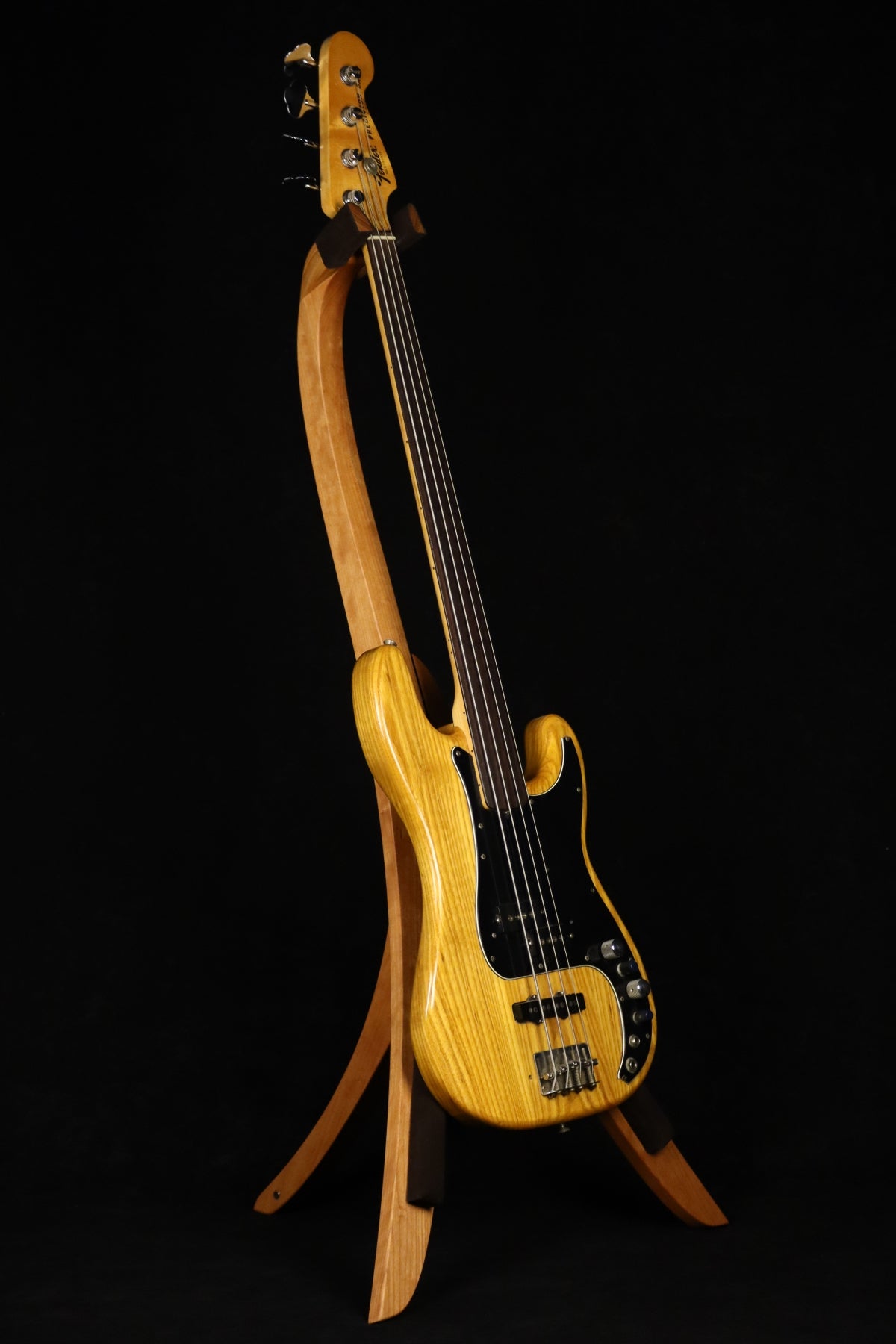 Folding cherry wood electric bass guitar floor stand full front image with Fender Precision 4 string fretless bass