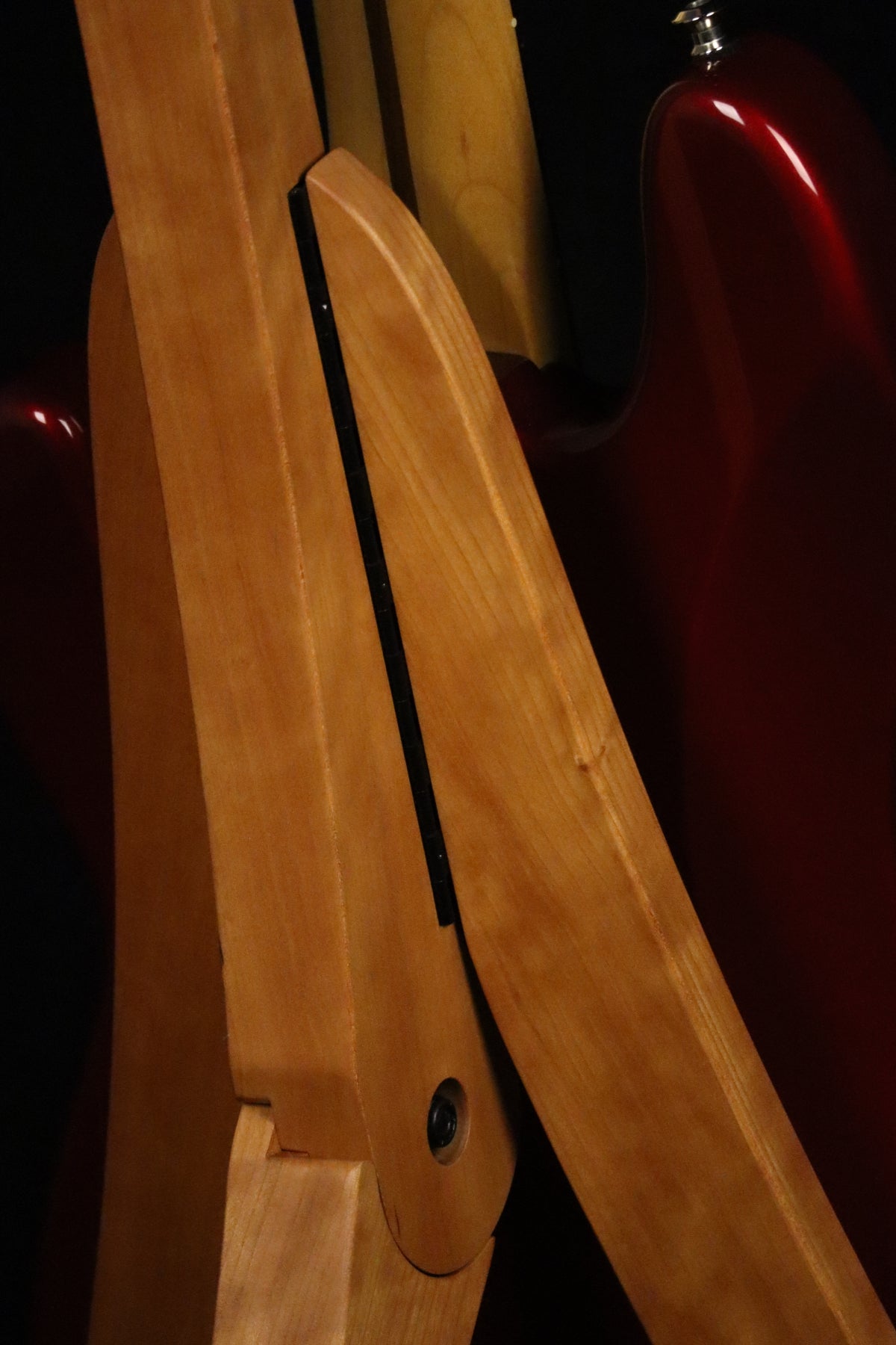 Folding cherry wood guitar floor stand closeup rear image