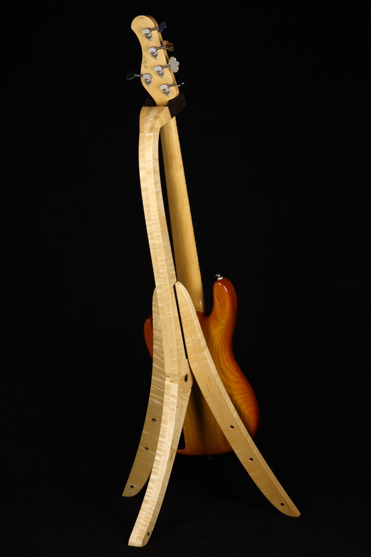 Folding curly maple wood electric bass guitar floor stand full rear image with Sadowsky 5 string bass
