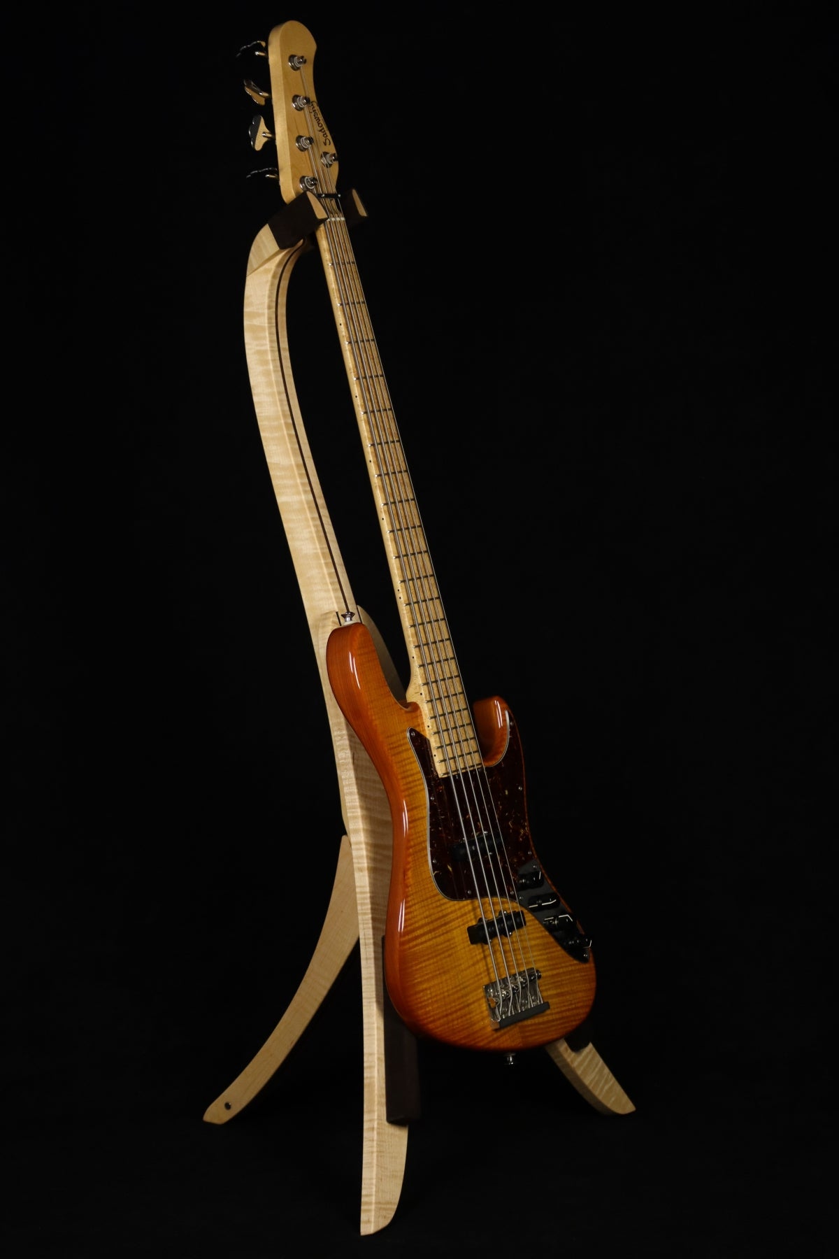 Folding curly maple and walnut wood electric bass guitar floor stand full front image with Sadowsky 5 string bass
