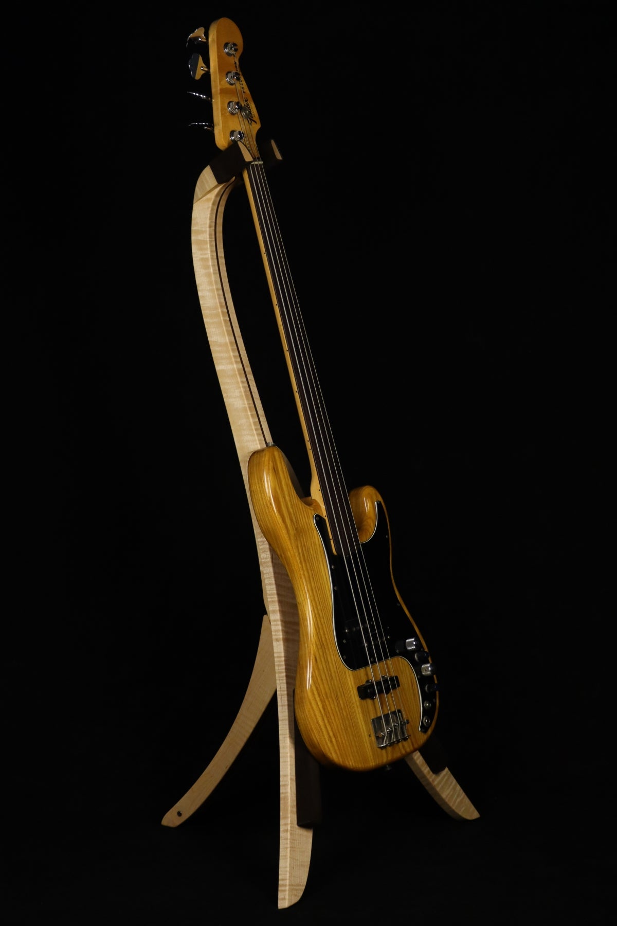 Folding curly maple and walnut wood electric bass guitar floor stand full front image with Fender Precision 4 string fretless bass