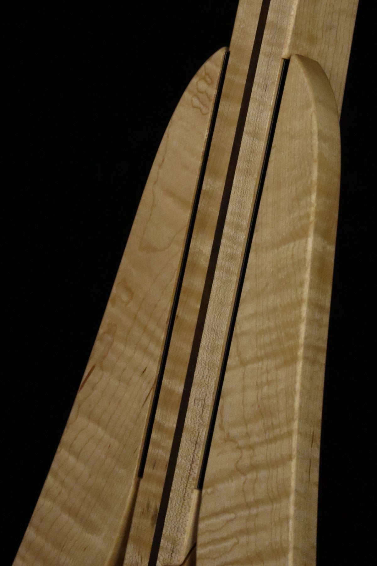 Folding curly maple and walnut wood electric bass guitar floor stand closeup front image