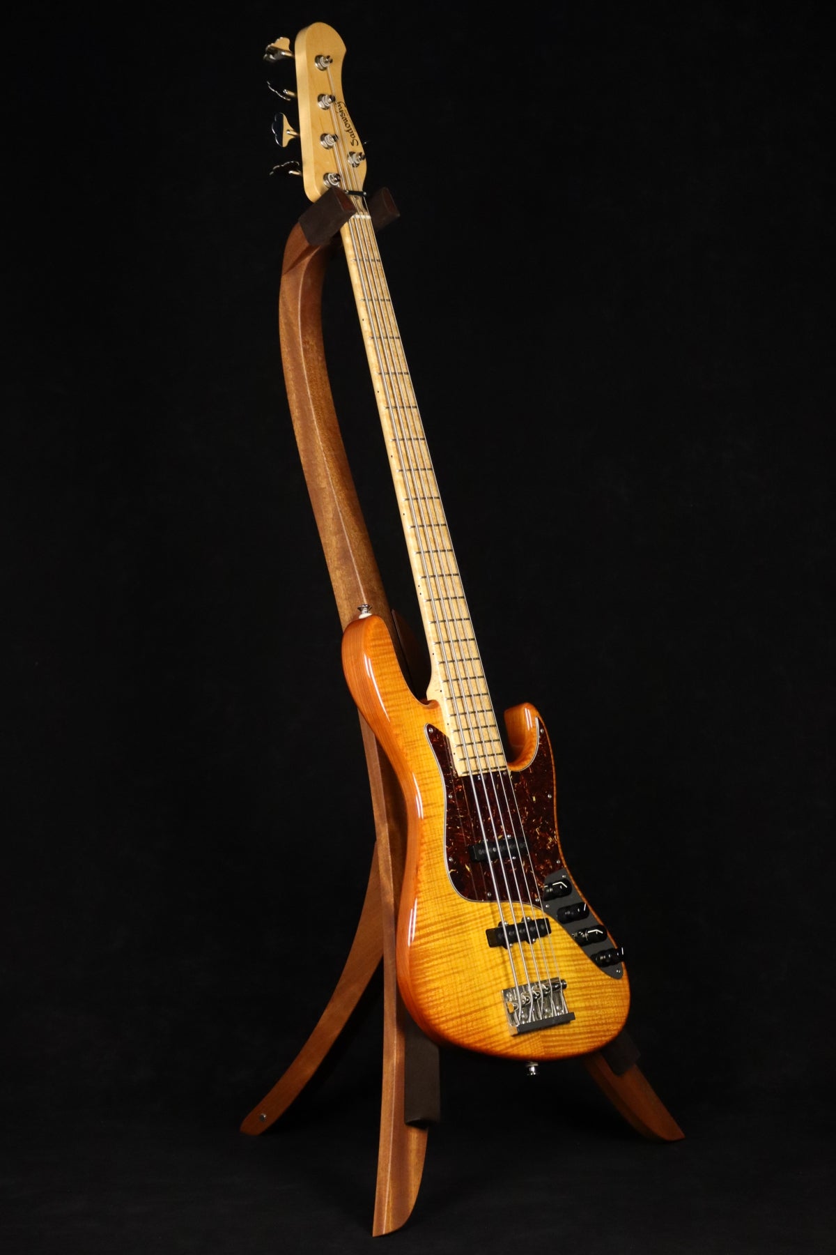 Folding sapele mahogany wood electric bass guitar floor stand full front image with Sadowsky 5 string bass