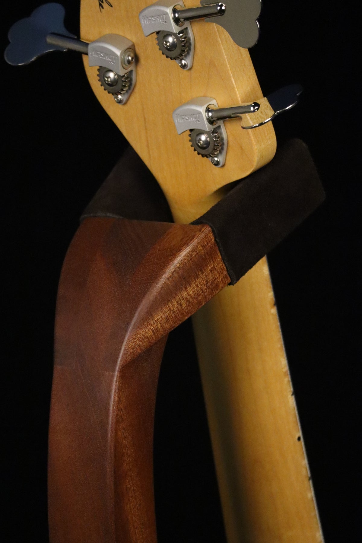 Folding sapele mahogany wood electric bass guitar floor stand closeup rear yoke detail image