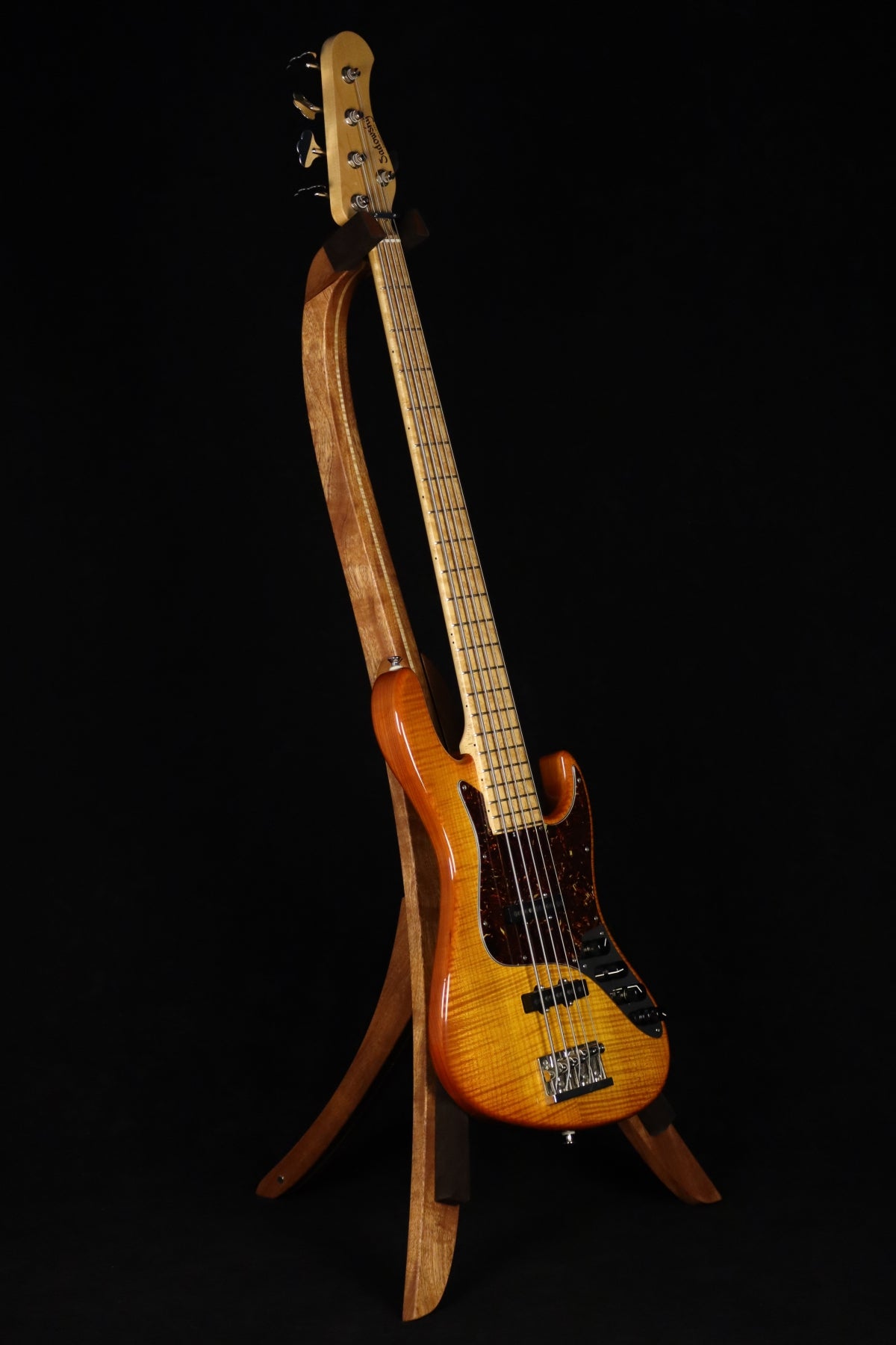 Folding sapele mahogany and curly maple wood electric bass guitar floor stand full front image with Sadowsky 5 string bass