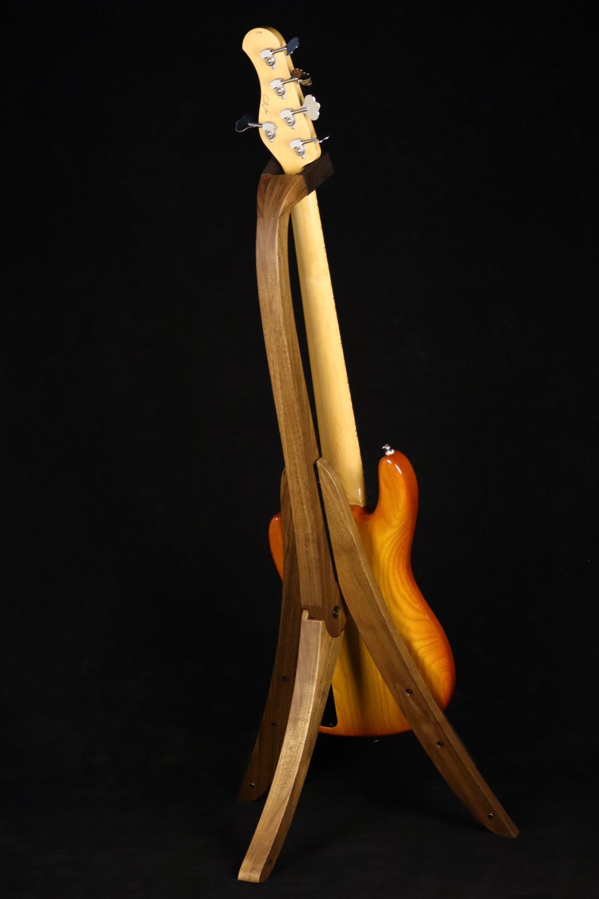 Folding walnut wood electric bass guitar floor stand full rear image with Sadowsky 5 string bass