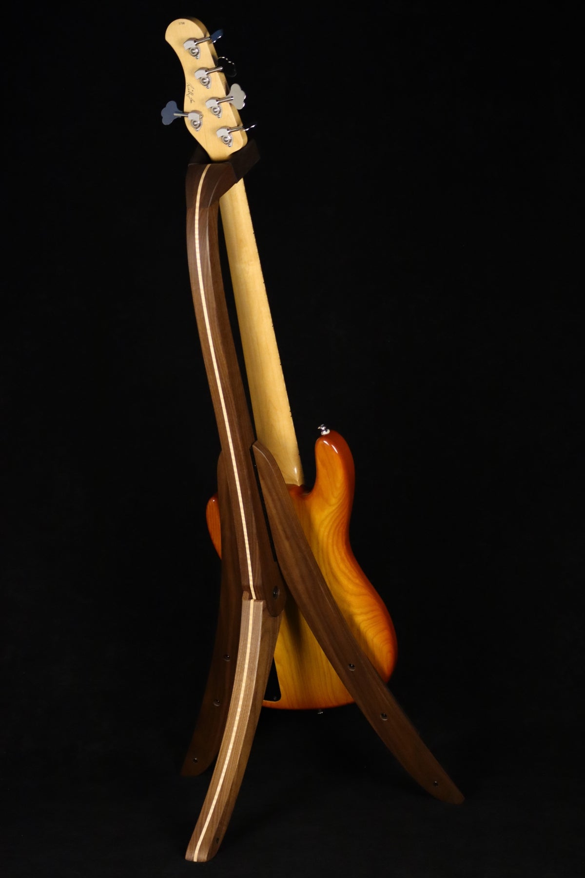Folding walnut and curly maple wood electric bass guitar floor stand full rear image with Sadowsky 5 string bass