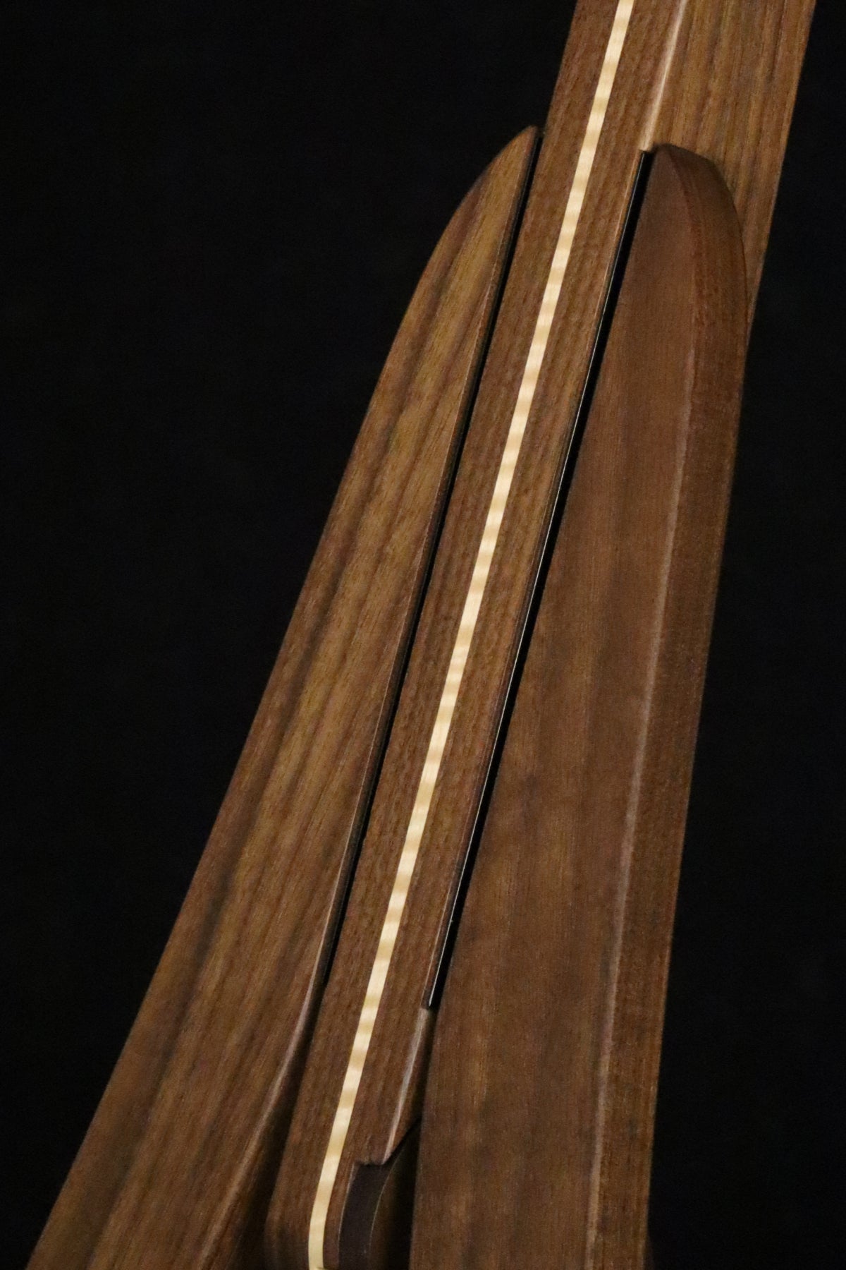 Folding walnut and curly maple wood electric bass guitar floor stand closeup front image