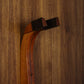 Cherry and walnut wood guitar wall mount hanger installed on paneled wall