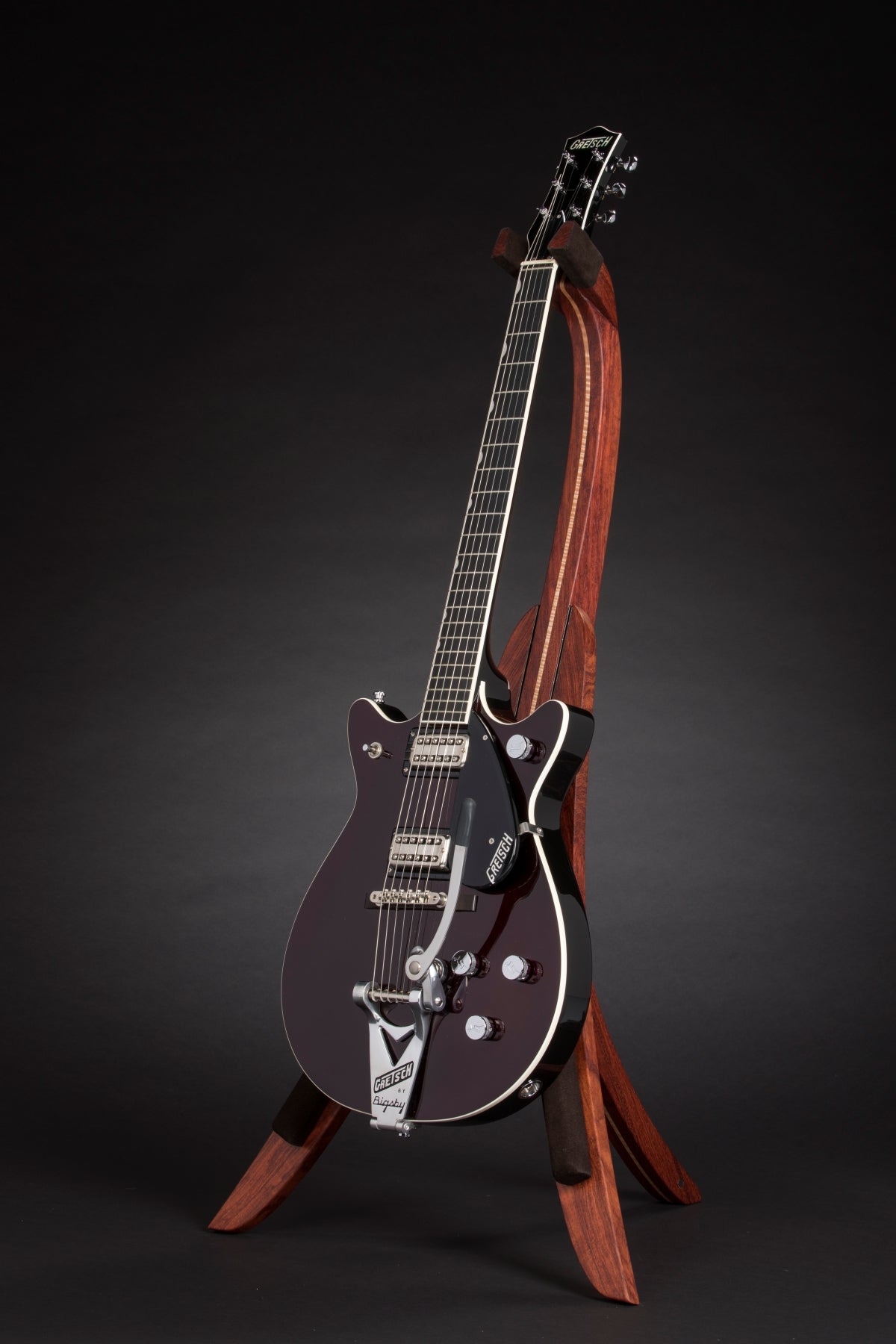 Folding bubinga rosewood and curly maple wood guitar floor stand full front image with Gretsch guitar