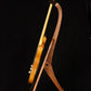 Folding bubinga rosewood and curly maple wood guitar floor stand full side image with Fender guitar