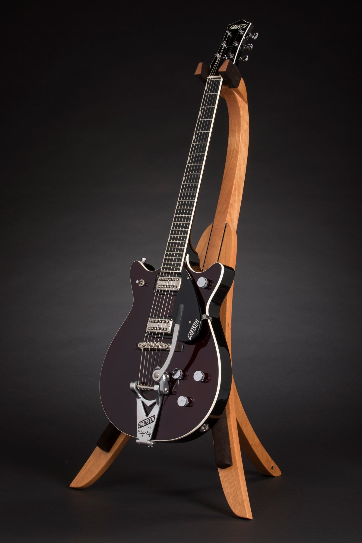 Folding cherry wood guitar floor stand full front image with Gretsch guitar
