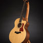 Folding cherry wood guitar floor stand full front image with Taylor guitar