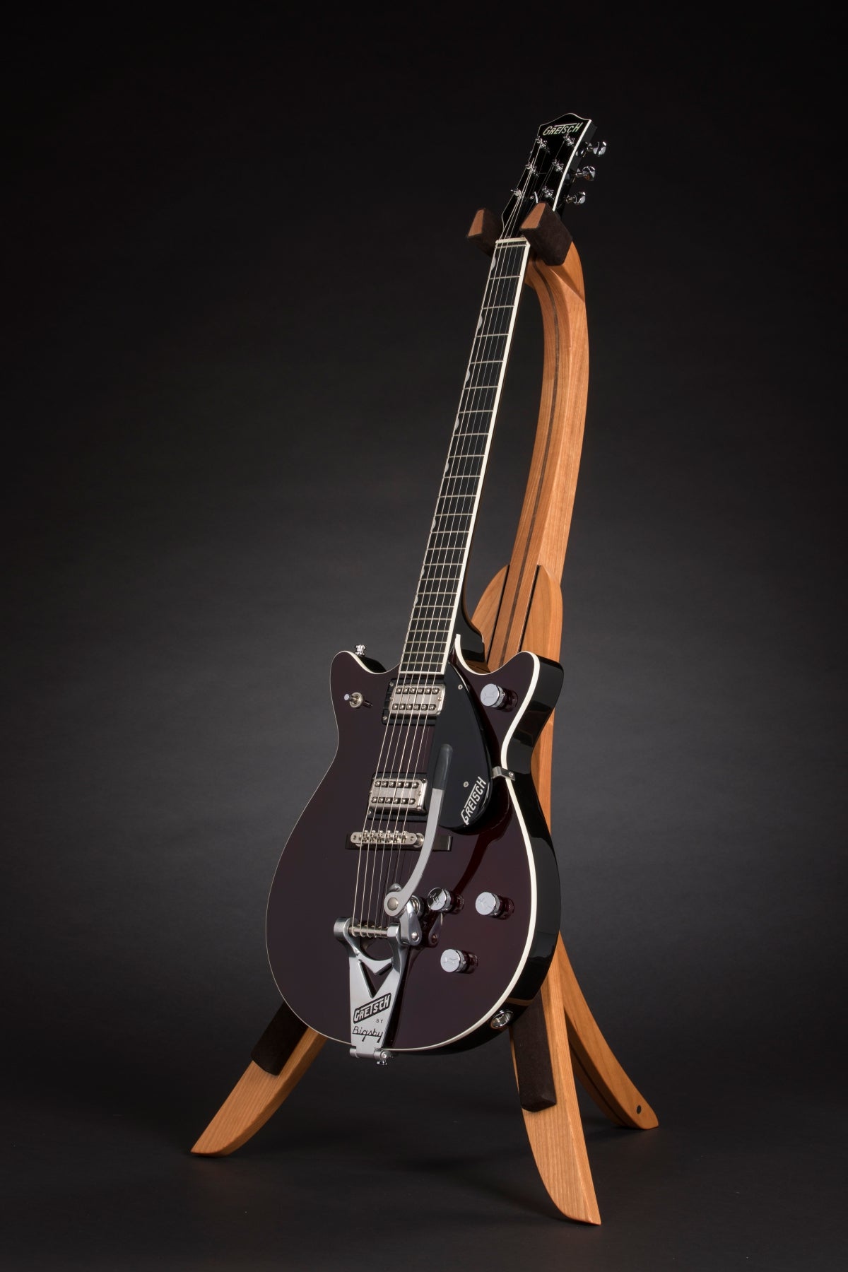 Folding cherry and walnut wood guitar floor stand full front image with Gretsch guitar