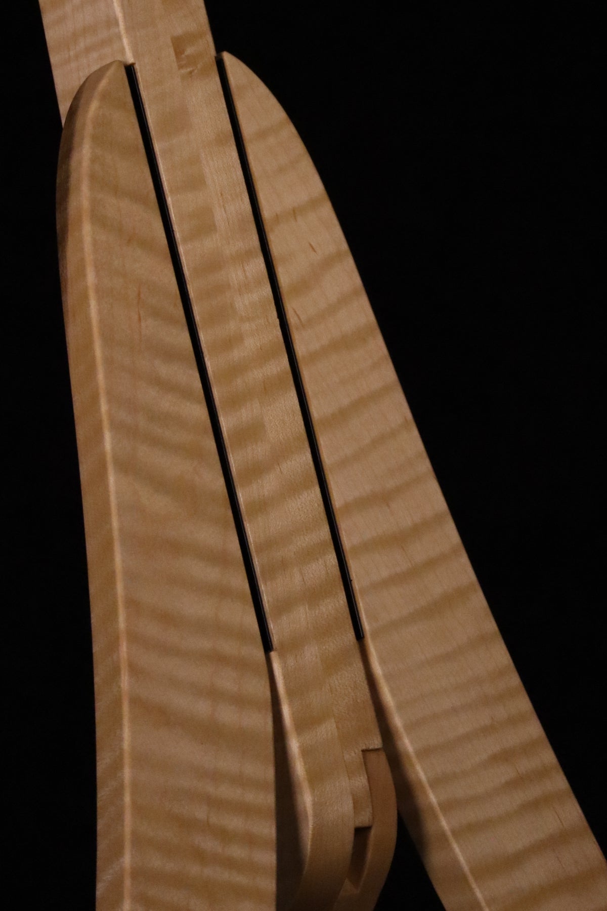 Folding curly maple wood guitar floor stand closeup front image