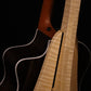 Folding curly maple wood guitar floor stand closeup rear image with Taylor guitar