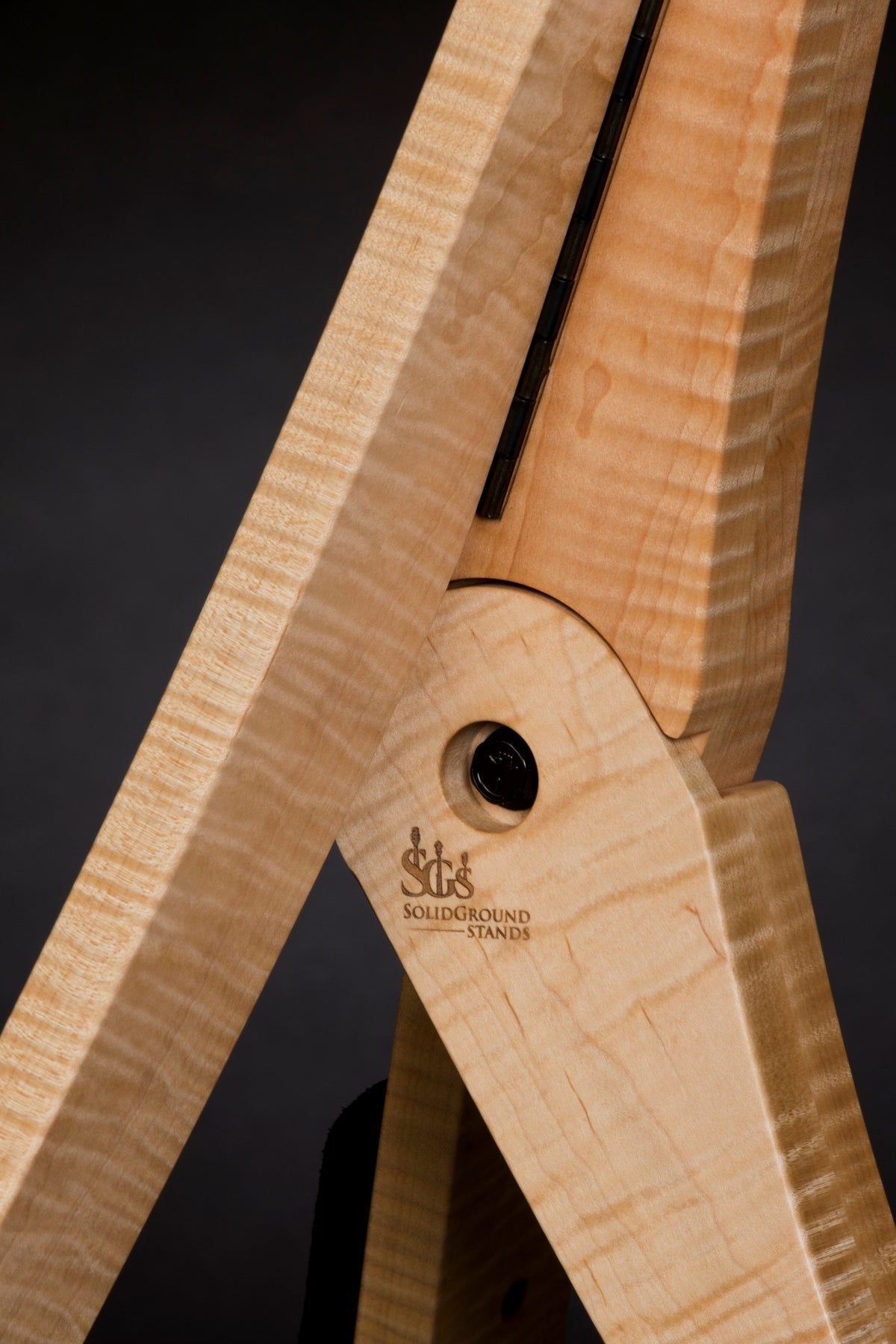 Folding curly maple wood guitar floor stand joinery detail image