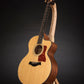 Folding curly maple and walnut wood guitar floor stand full front image with Taylor guitar