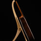Folding curly maple and walnut wood guitar floor stand full side image with Taylor guitar