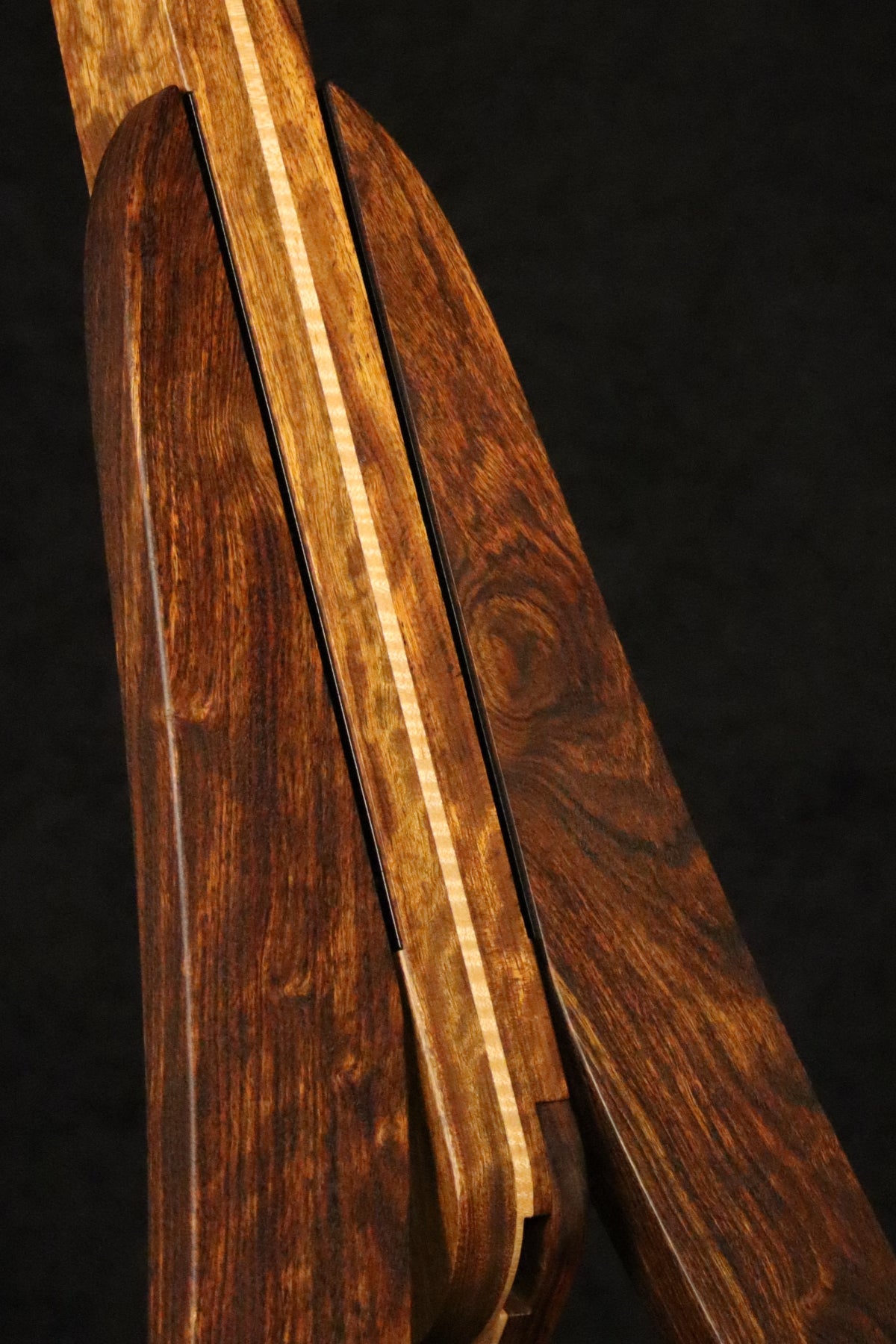 Folding chechen Caribbean rosewood and curly maple wood guitar floor stand closeup front image