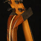 Folding morado Bolivian rosewood pau fero and curly maple wood guitar floor stand yoke detail image with Taylor guitar