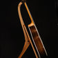 Folding morado Bolivian rosewood pau fero and curly maple wood guitar floor stand full side image with Taylor guitar
