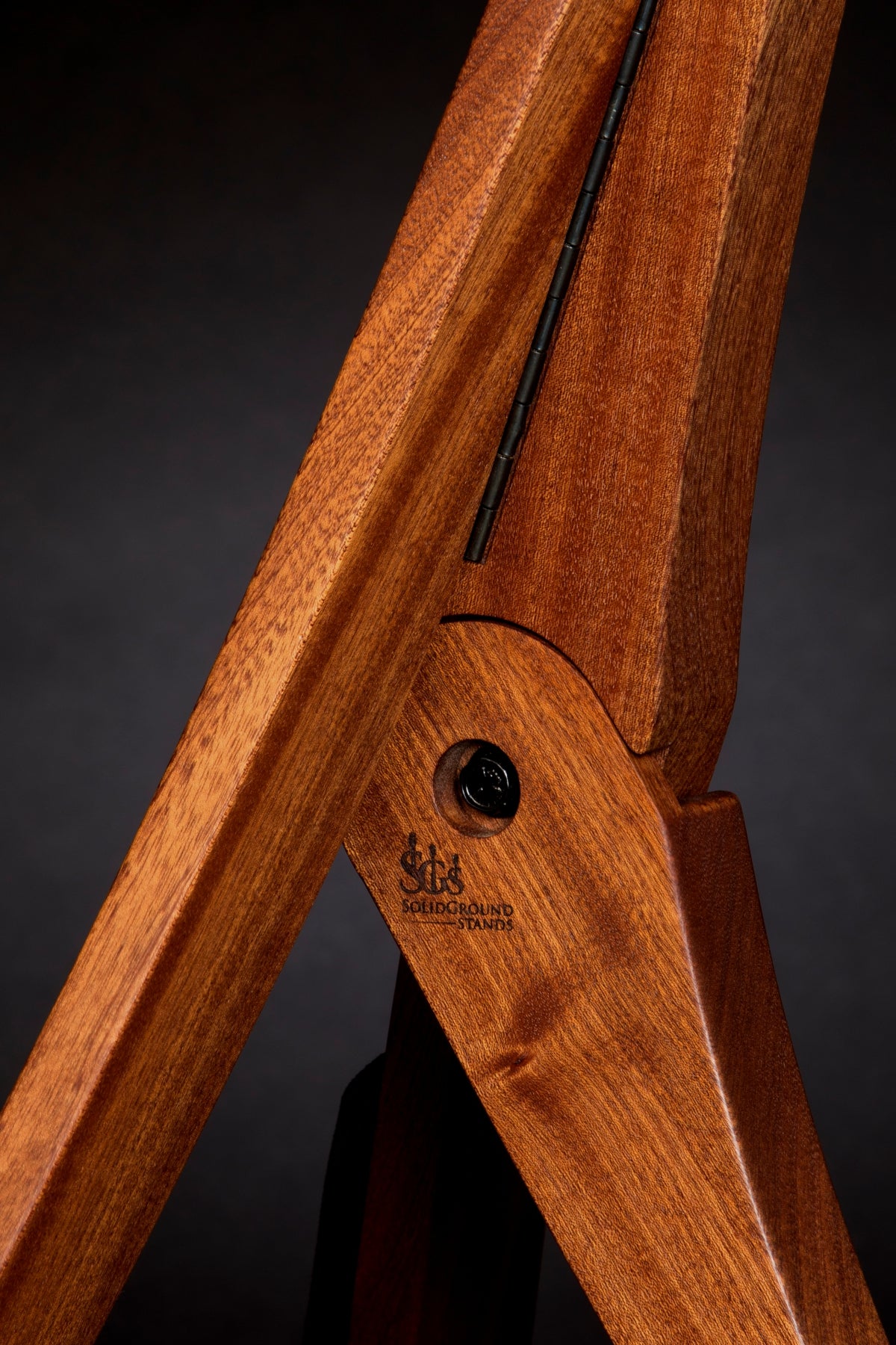 Folding sapele mahogany wood guitar floor stand joinery detail image