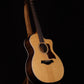 Folding walnut wood guitar floor stand full front image with Taylor guitar