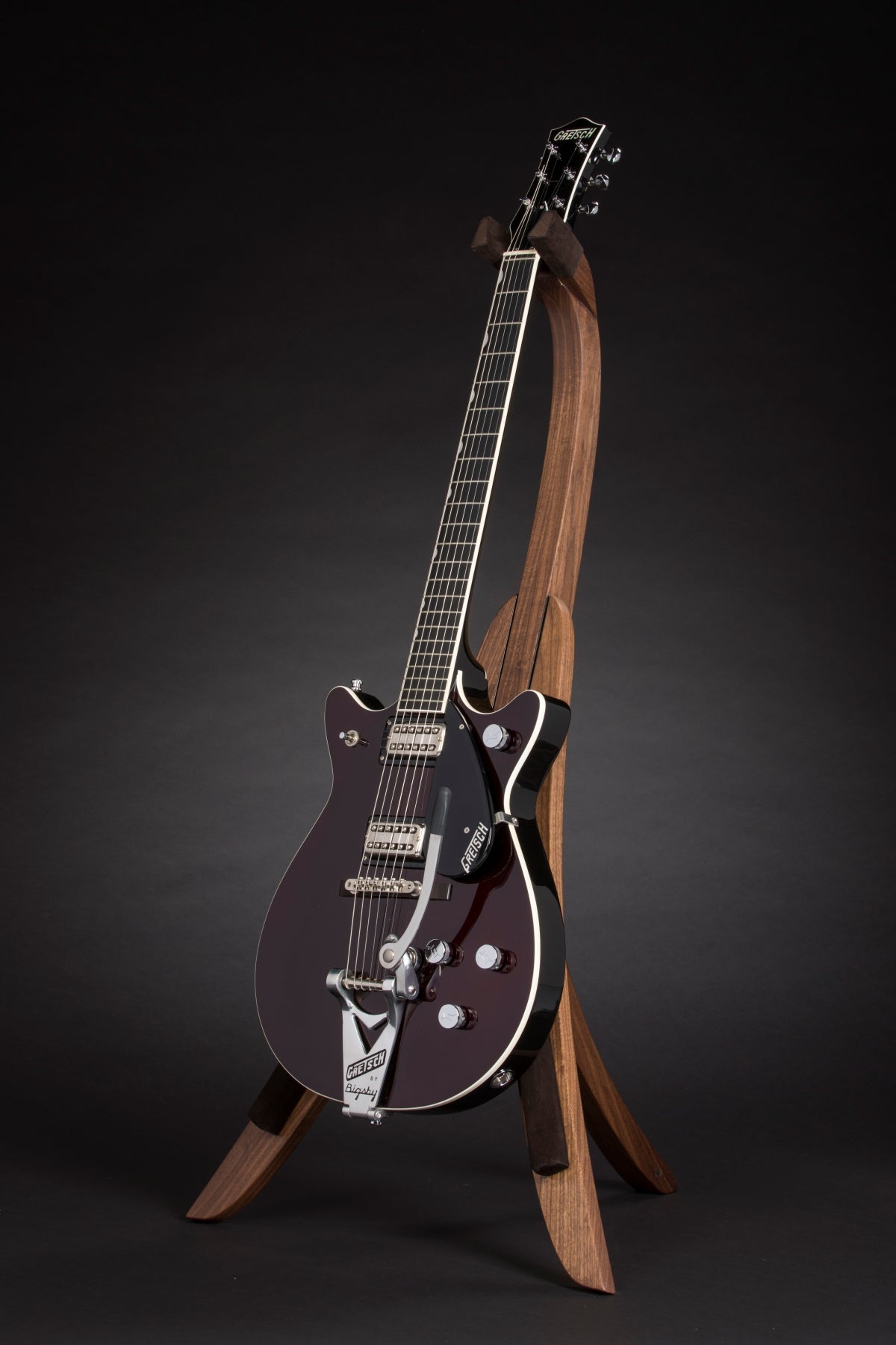 Folding walnut wood guitar floor stand full front image with Gretsch guitar