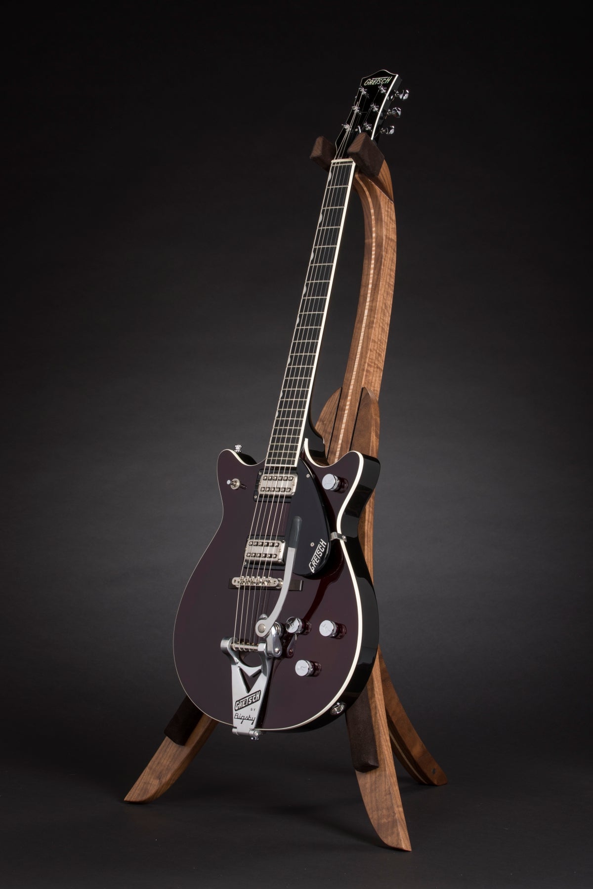 Folding walnut and curly maple wood guitar floor stand full front image with Gretsch guitar