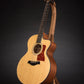 Folding walnut and curly maple wood guitar floor stand full front image with Taylor guitar