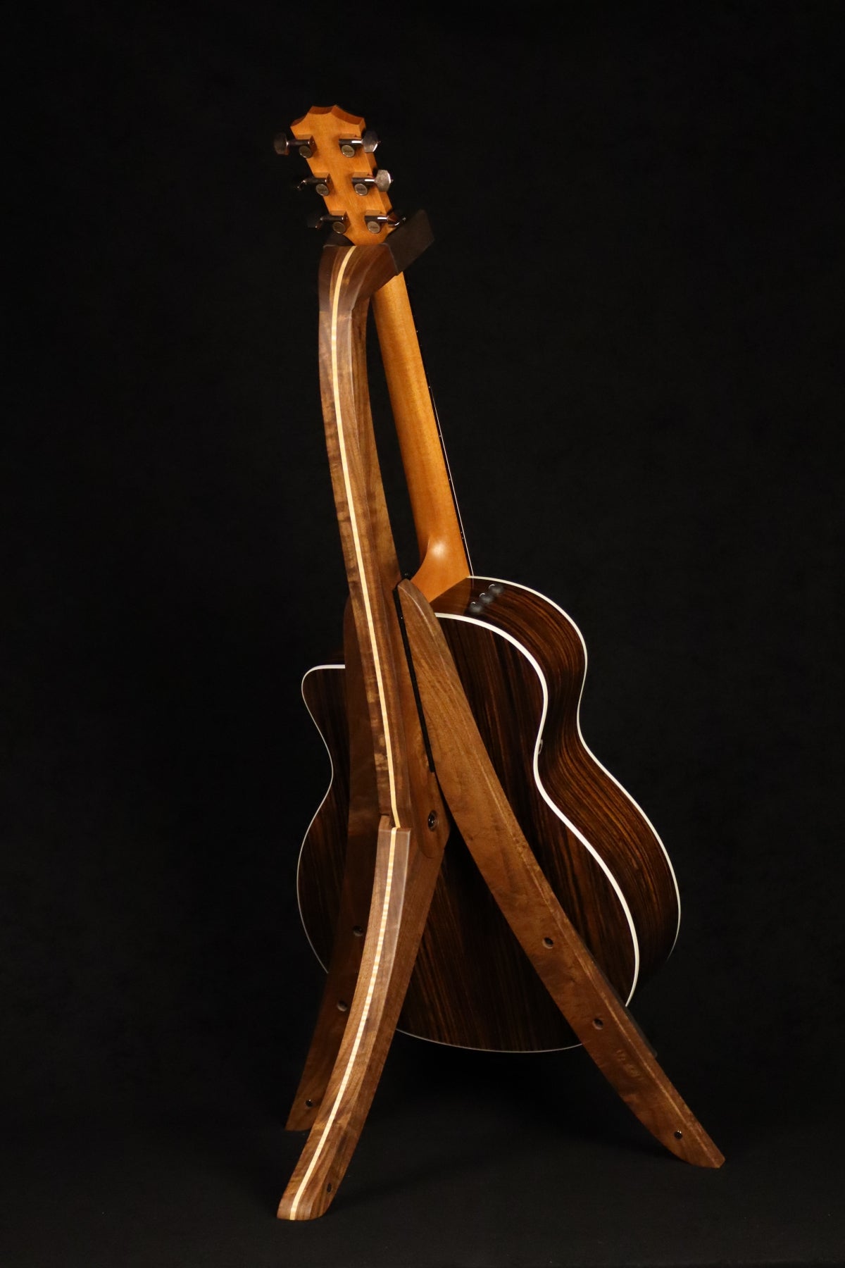 Folding walnut and curly maple wood guitar floor stand full rear image with Taylor guitar