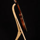 Folding curly maple wood mandolin floor stand full side image with Eastman mandolin