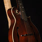 Folding curly maple wood mandolin floor stand closeup front image with Eastman mandolin