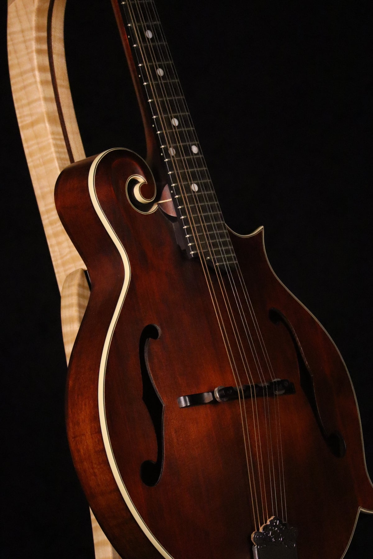 Folding curly maple and walnut wood mandolin floor stand closeup front image with Eastman mandolin