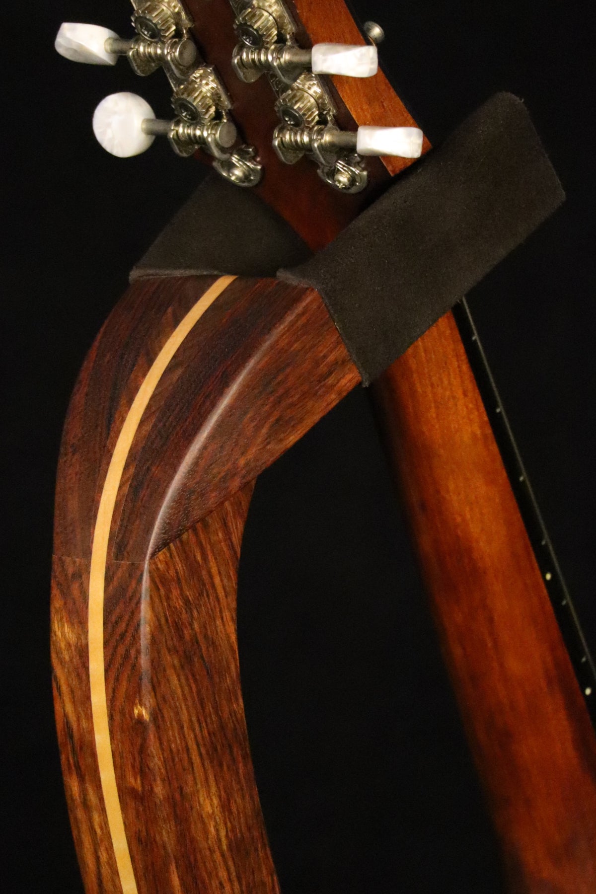 Folding chechen Caribbean rosewood and curly maple wood mandolin floor stand yoke detail image with Eastman mandolin