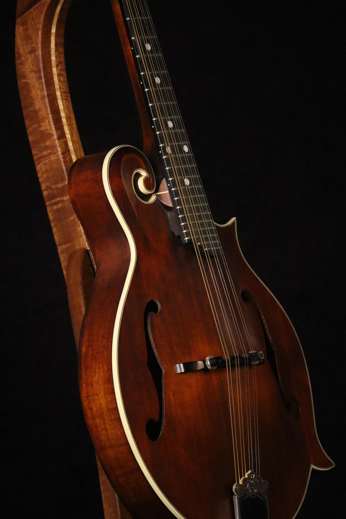 Folding sapele mahogany and curly maple wood mandolin floor stand closeup front image with Eastman mandolin