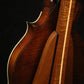 Folding sapele mahogany and curly maple wood mandolin floor stand closeup rear image with Eastman mandolin