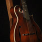 Folding walnut wood mandolin floor stand closeup front image with Eastman mandolin