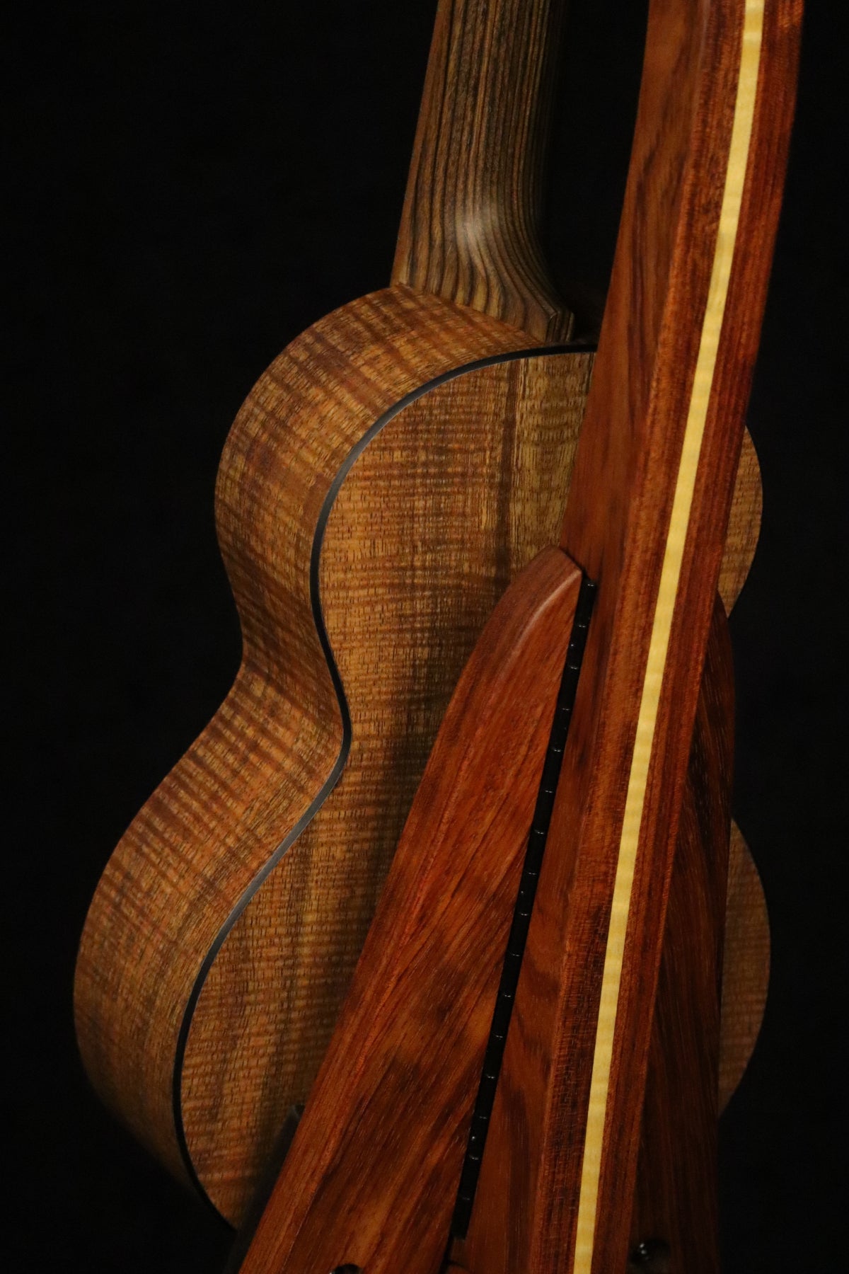 Folding bubinga rosewood and curly maple wood ukulele floor stand closeup rear image with Martin ukulele