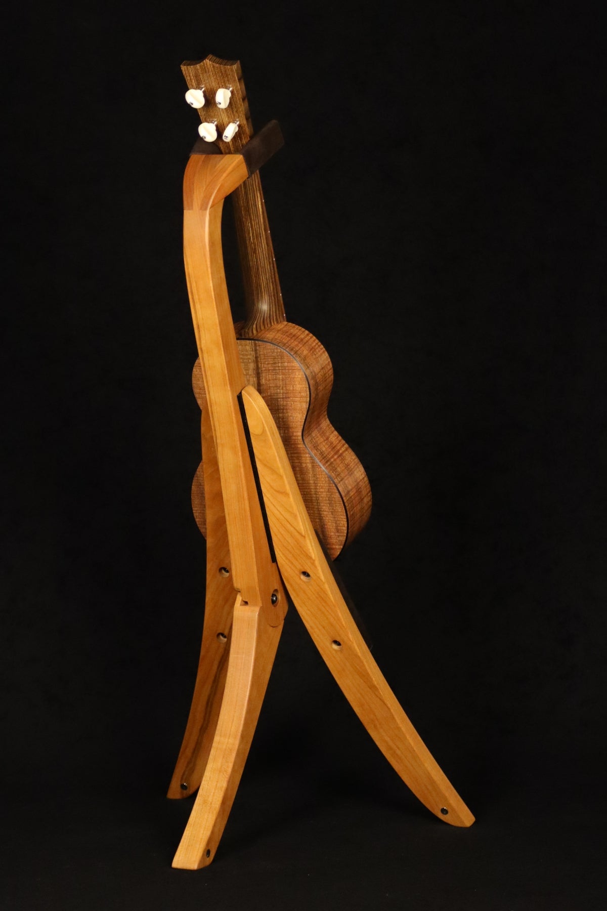 Folding cherry wood ukulele floor stand full rear image with Martin ukulele