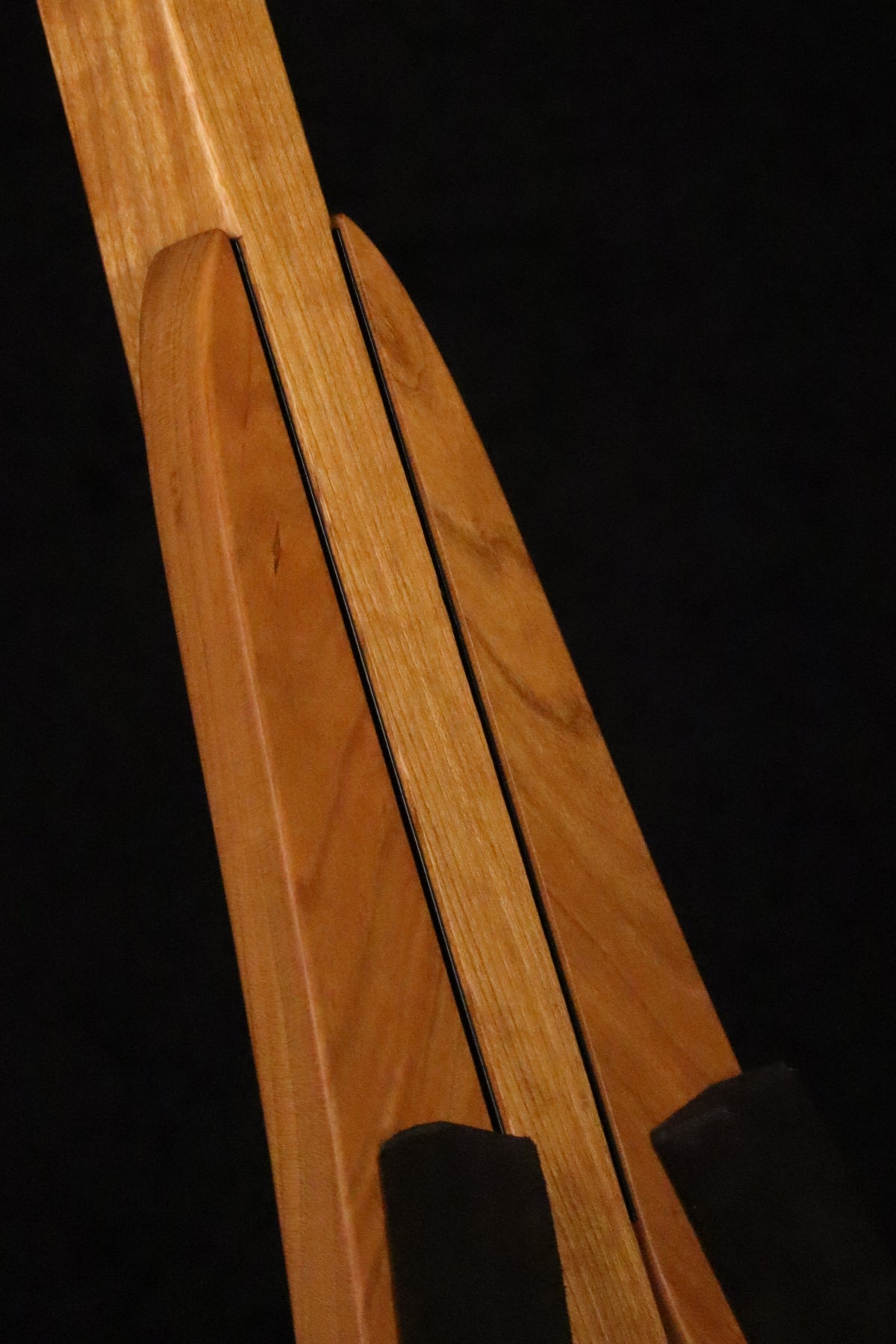Folding cherry wood ukulele floor stand closeup front image