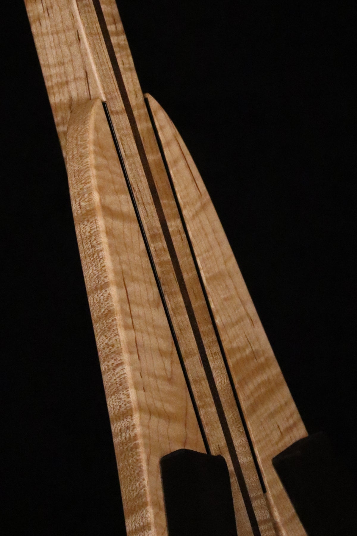 Folding curly maple and walnut wood ukulele floor stand closeup front image