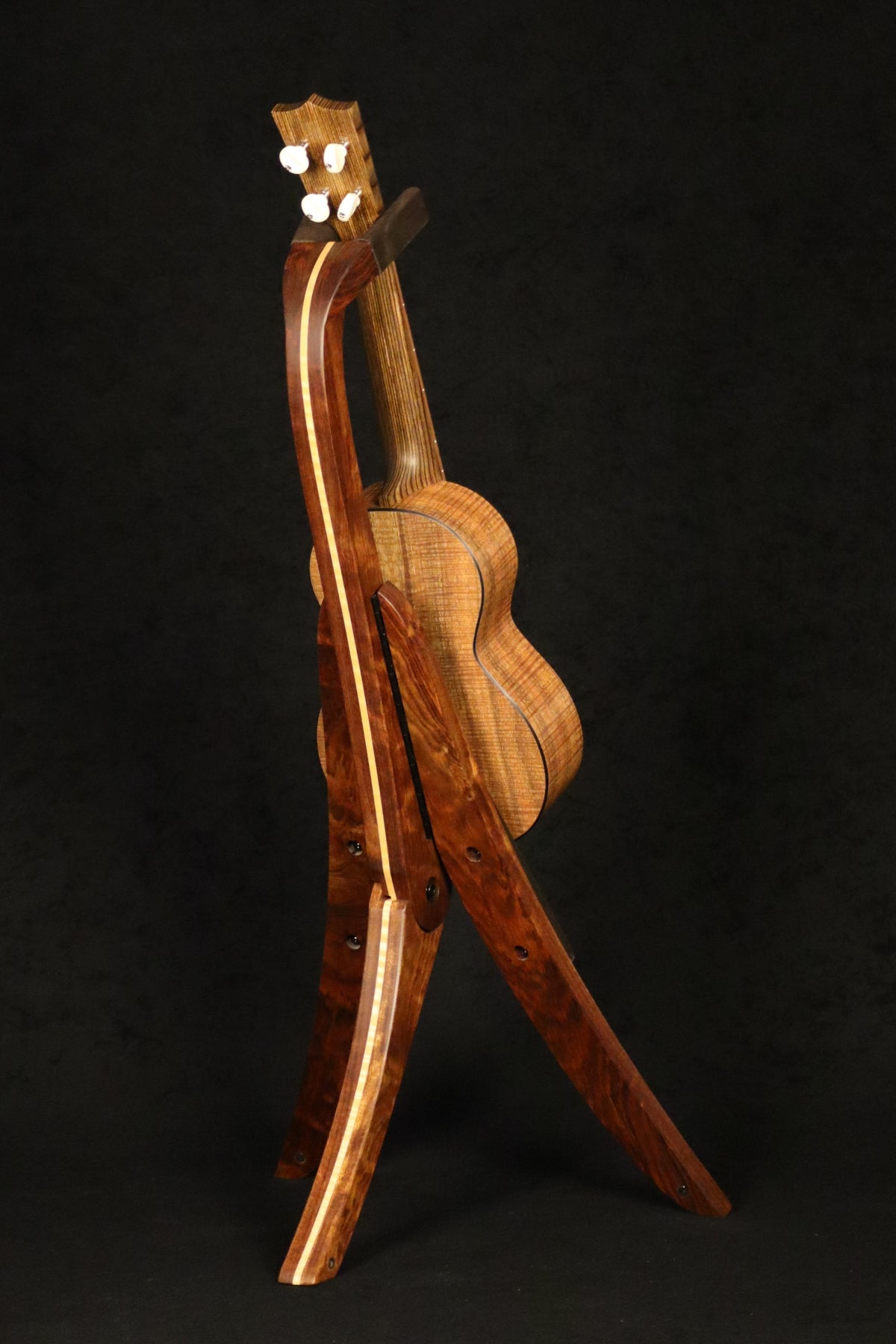 Folding chechen Caribbean rosewood and curly maple wood ukulele floor stand full rear image with Martin ukulele