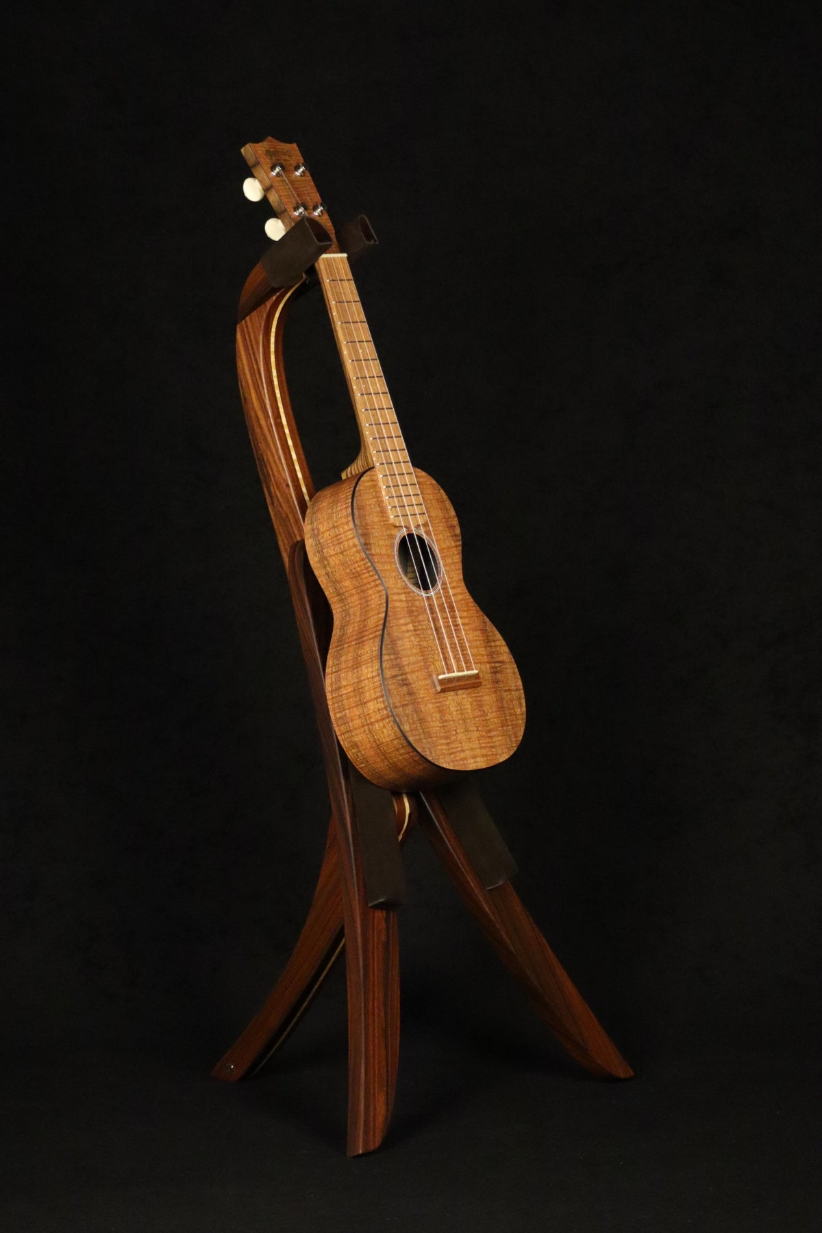 Folding morado Bolivian rosewood pau fero  curly maple wood ukulele floor stand full front image with Martin ukulele
